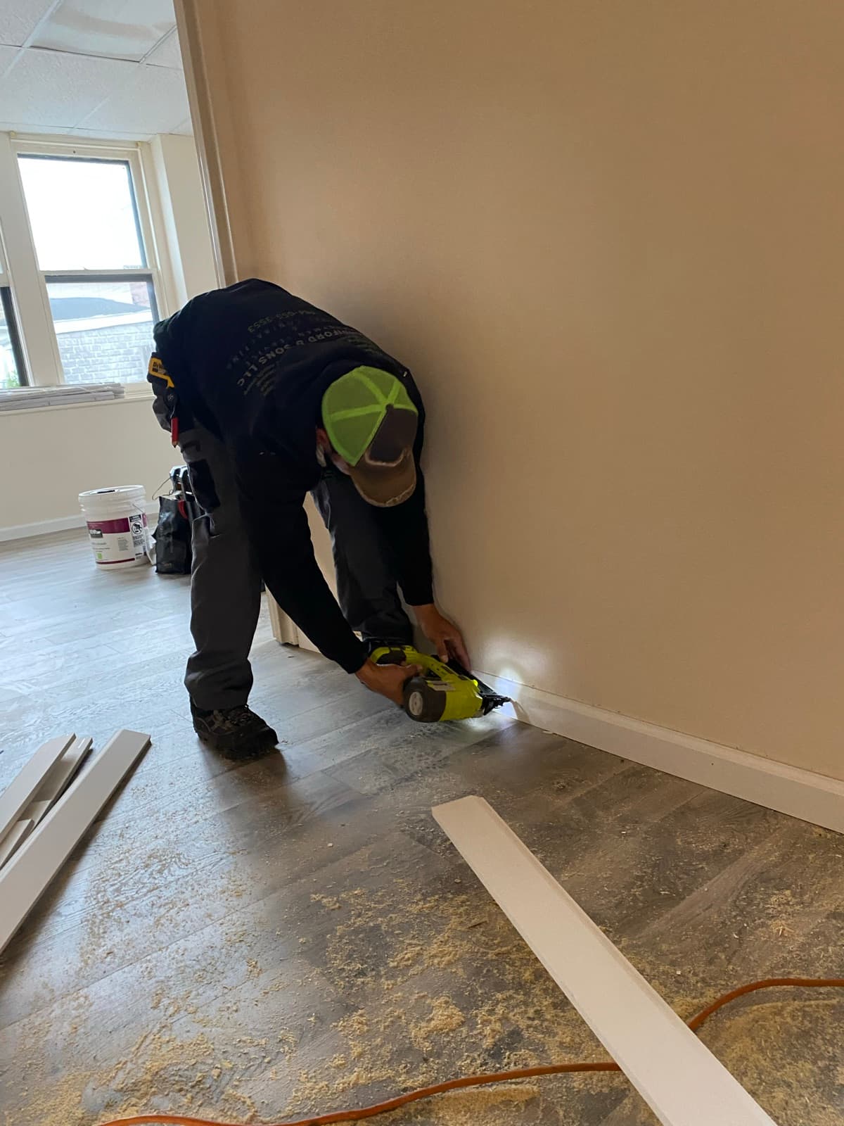 Luxury vinyl plank being installed over the prepped subfloor in Easton