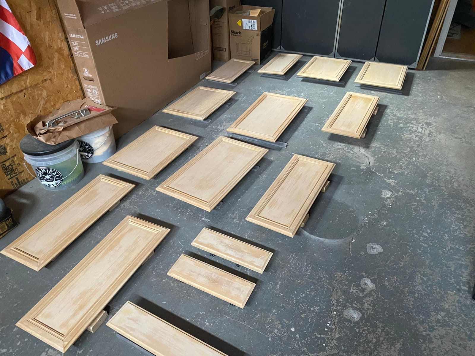 Cabinet doors laid out and sanded for spraying