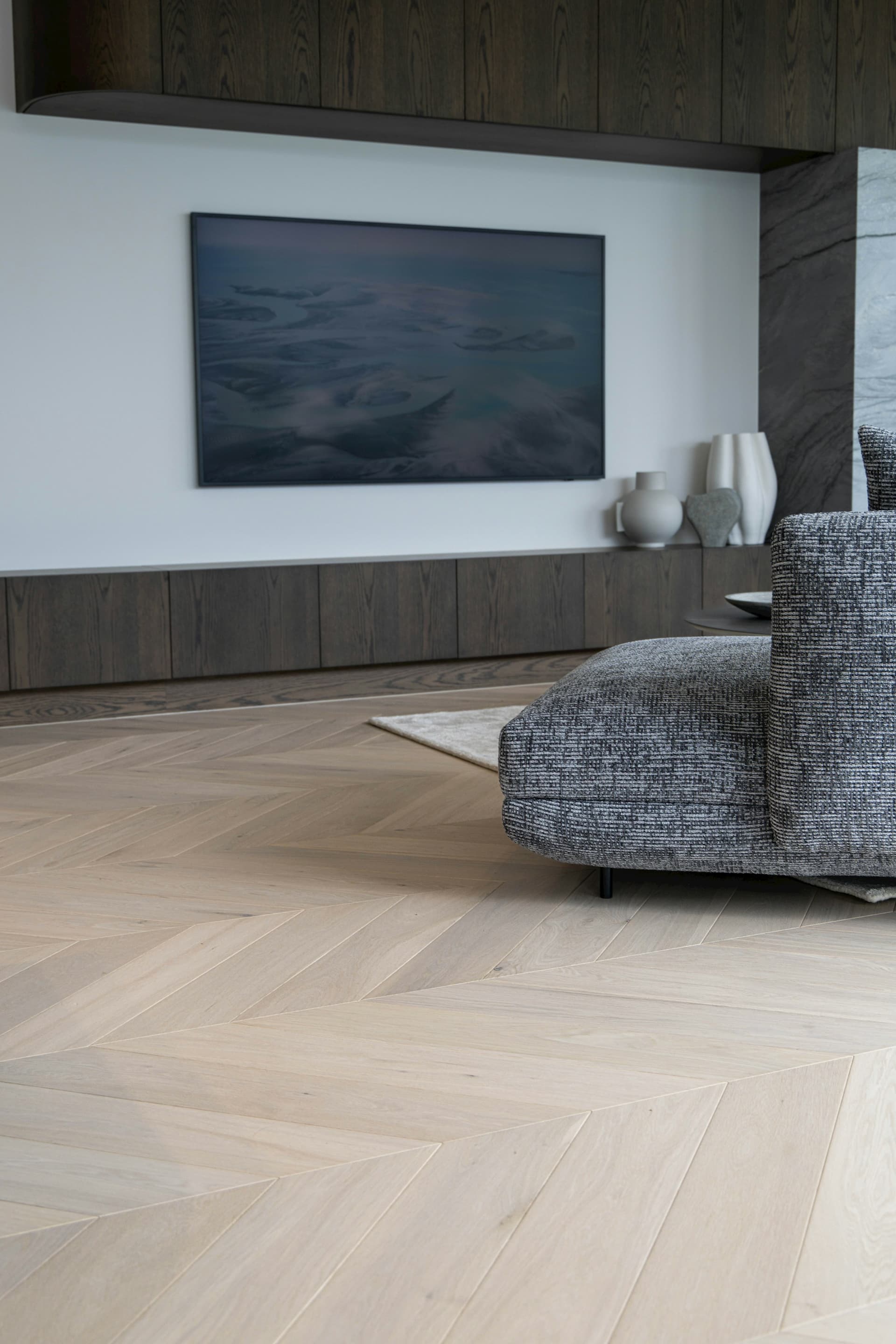 Herringbone wood flooring in a modern living room